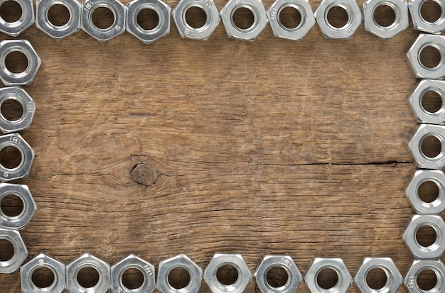 Metal nuts tool on wood