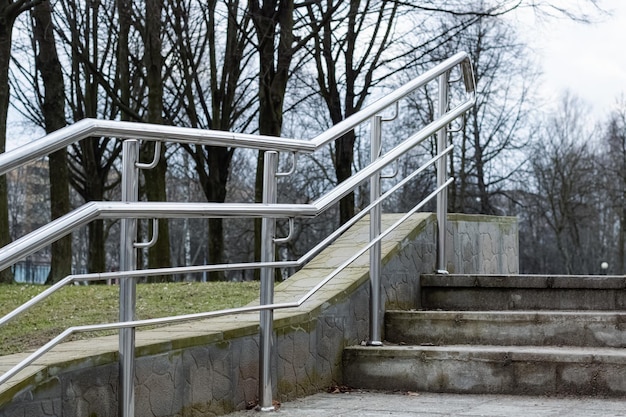 Metal railing stairs in the park close up