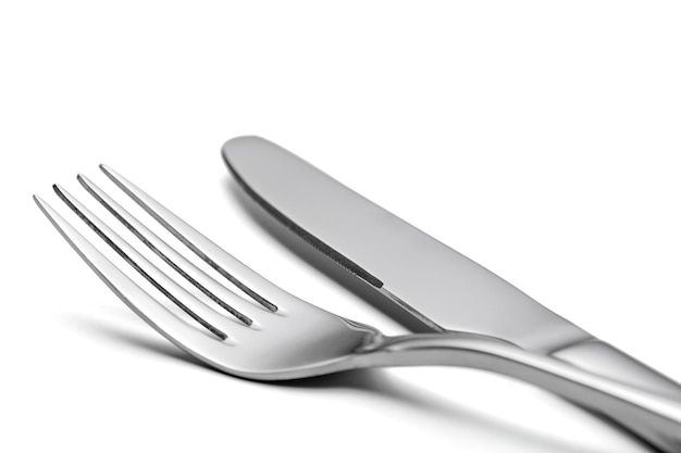 The metal shiny fork and knife on a white background