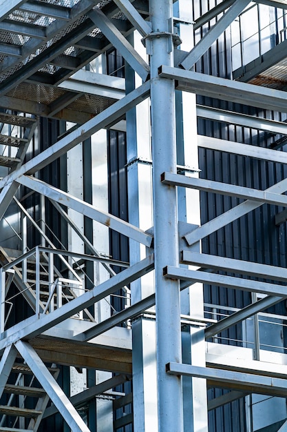 Metal stairs at factory. Steel construction at plant. Modern equipment and onterior. Closeup.