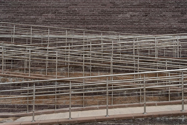 Metal structures on the background of the wall a ramp for people with disabilities