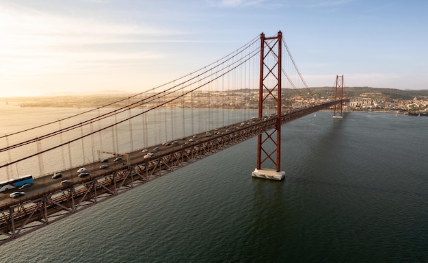 Metal suspension bridge over river in city