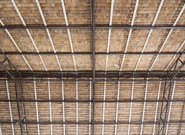 Metal and wooden frame with the dry palm leaves.