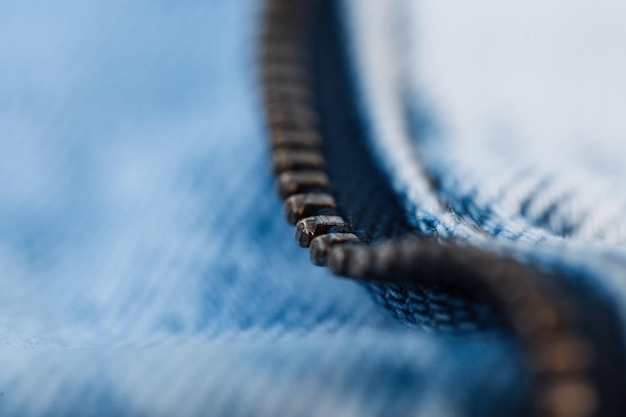 Photo metal zipper and blue jeans texture macro fashion denim