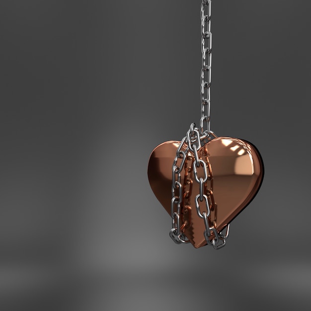 Metallic heart hanging in a chain