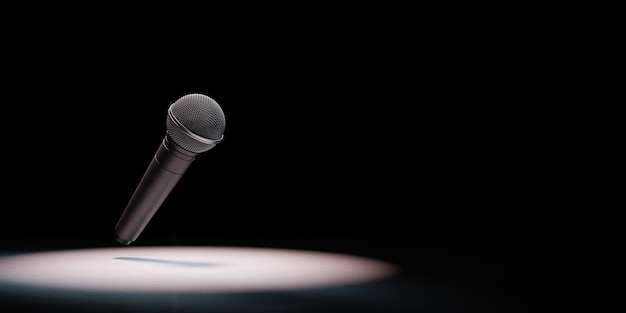 Photo metallic microphone spotlighted on black background