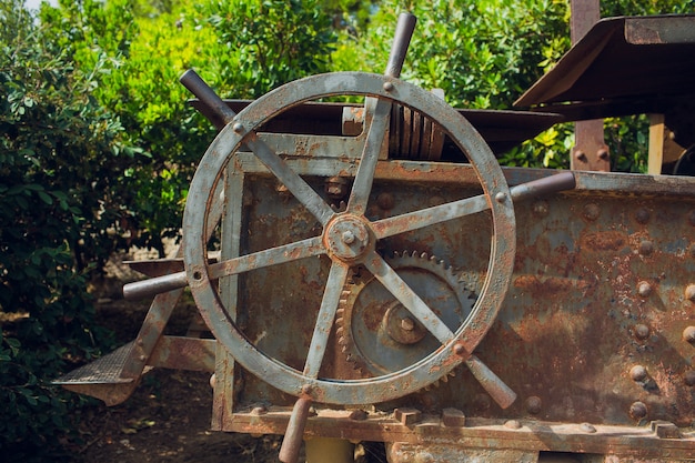 Metallic Rusty industrial machine parts closeup photo.