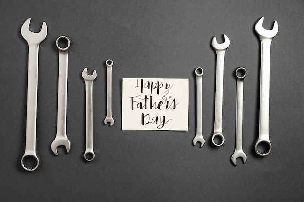 Metallic wrenches with a greeting card