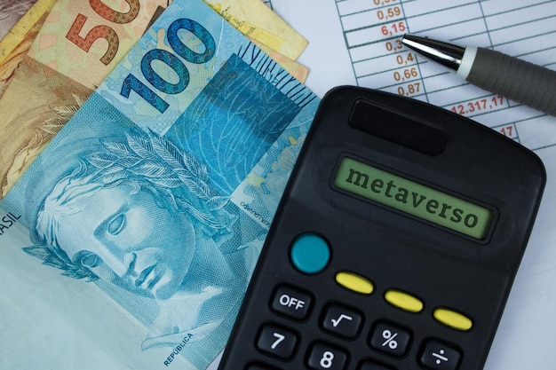 Metaverse written in portuguese in calculator with brazilian money background Modern Metaverse Finance image