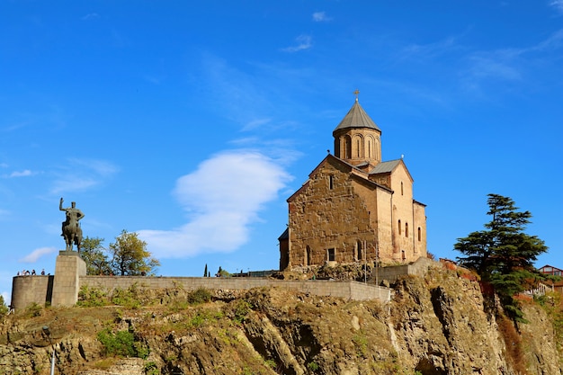 Metekhi Church with King Vakhtang Gorgasali Statue on Rocky Outcrop in Tbilisi City, Georgia