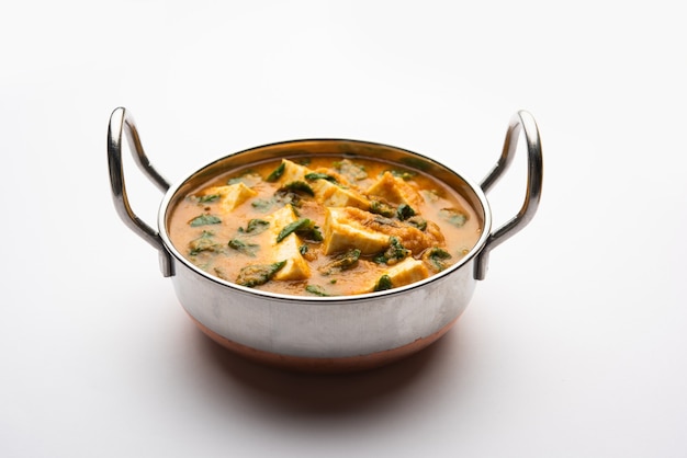 Methi Paneer Sabzi or Indian Style Cottage Cheese with fenugreek leaves curry recipe. Served in a bowl or Karahi