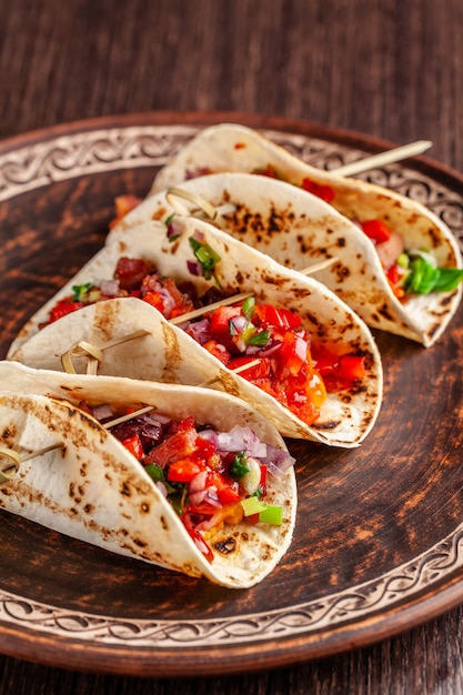 Mexican appetizer Tacos with vegetables