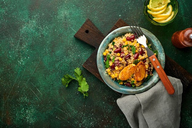 mexican black bean corn quinoa salad with caramelized lemon in old vintage clay bowl