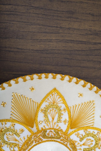 Mexican charro hat on wooden table Mariachi hat Typical mexican sombrero