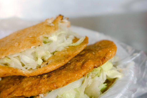 Mexican food gorditas fried in oil of meat crumbs and cheese