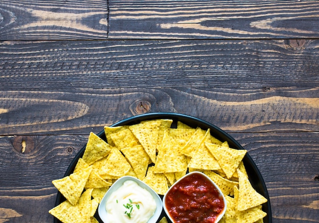 Mexican nachos chips  on wooden surface