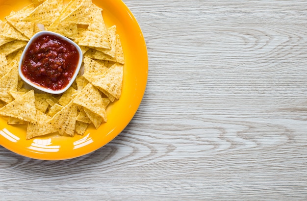 Mexican nachos chips  on wooden surface