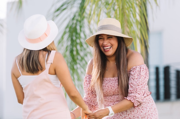 Mexican sisters smiling on summer vacation