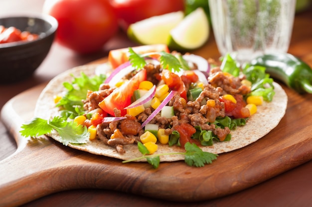 Mexican taco with beef tomato salsa onion corn