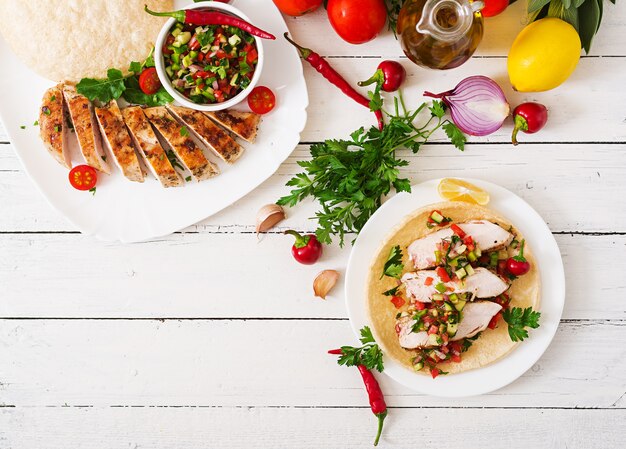 Mexican tacos with chicken and salsa.