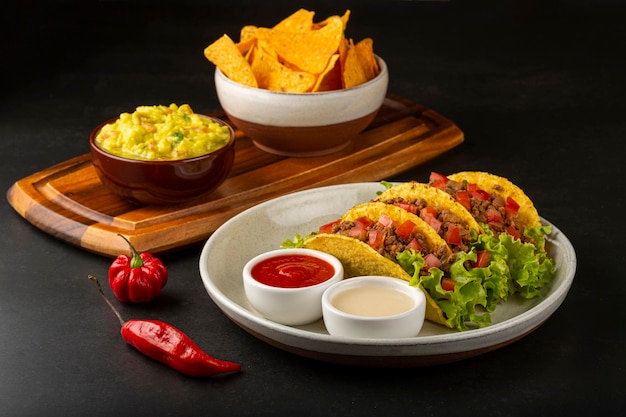 Mexican tacos with lettuce beef and tomatoes