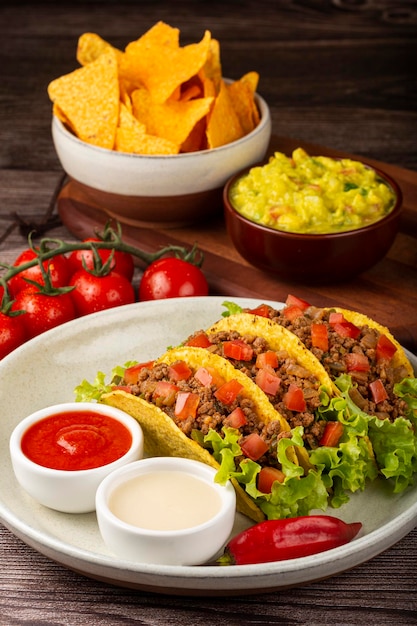 Mexican tacos with lettuce beef and tomatoes