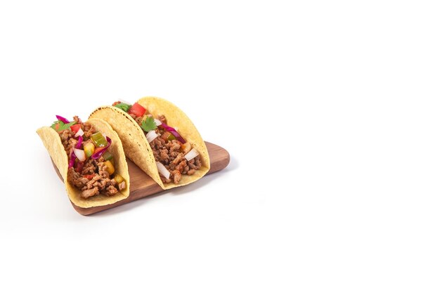 Mexican tacos with meat and vegetables isolated on white background with copy space