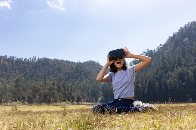 Mexican teenager wear vr glasses outside mexico metaverse concept