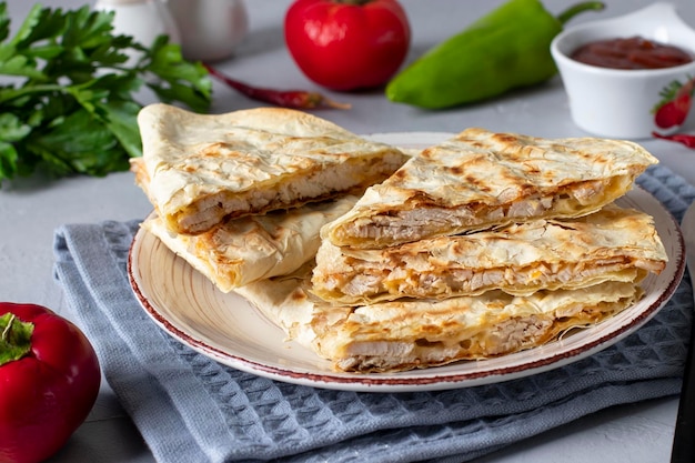 Mexican tortilla quesadilla with turkey cheese and tomato salsa Closeup