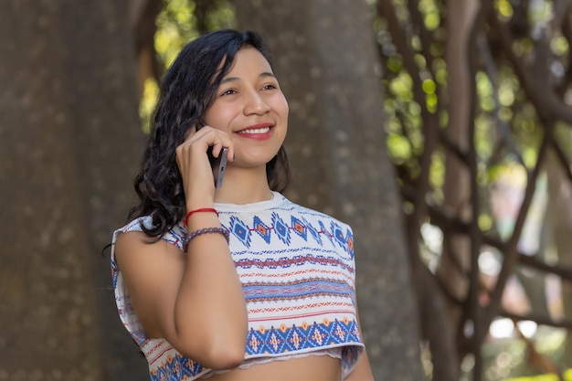 Mexican woman indigenous traits calling business woman