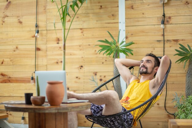 Mexican young man working on summer vacation financial freedom concept