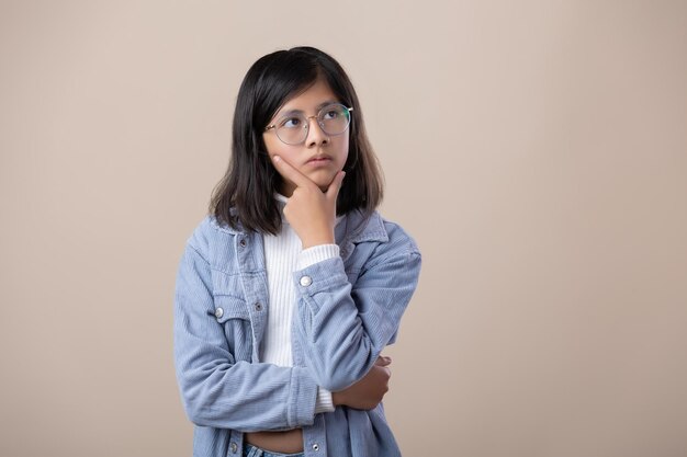 Mexican young woman wearing glasses thinking expression