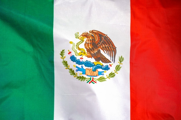 Mexico flag is depicted on a sports cloth fabric with many folds