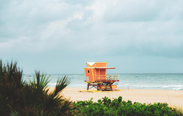 Miami beach with lifeguard tower and coastline with colorful cloud and blue sky travel holiday ocean