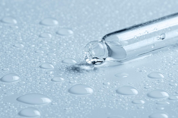 Micellar water drops and pipette Cosmetic product for moisturizing the skin or removing makeup Closeup macro photography