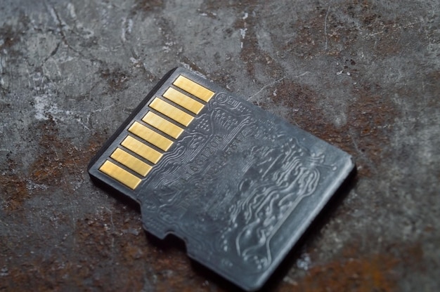 Micro sd card lies on a dark background closeup