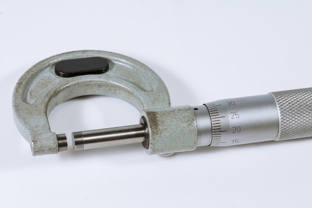 Micrometer on a white background. Modern measuring device.