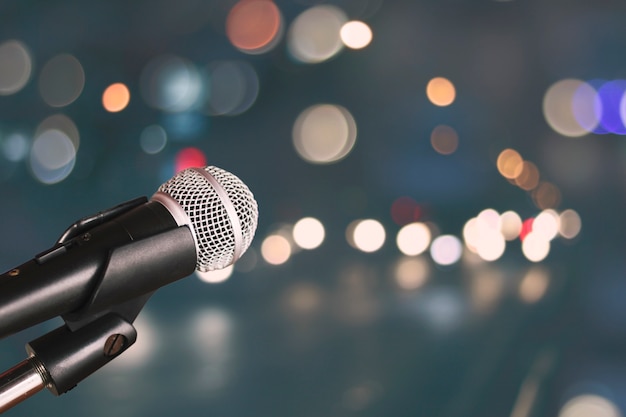 Microphone on blur bokeh of light and hall background, Music and singing concept