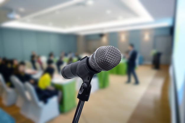 Microphone over the blurred business forum Meeting or Conference Training Learning Coaching Room Concept, Blurred background.