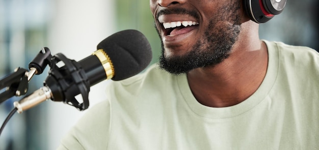 Microphone headphones and man streaming live closeup and media broadcast with web radio host Happy person influencer or content creator with mic internet recording and networking with happiness