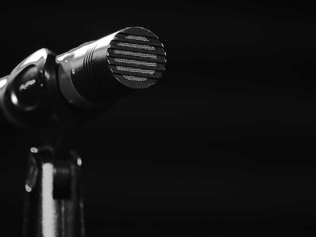 Photo a microphone is on a black background with the words quot the word quot on the top