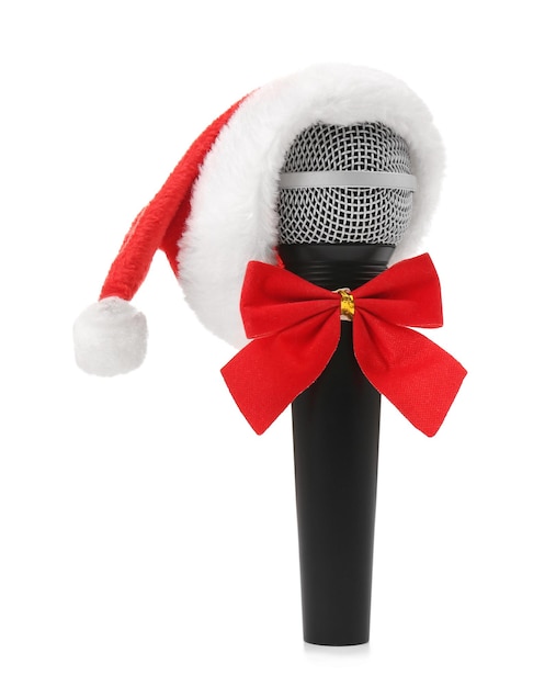 Microphone in Santa hat with bow on white background. Christmas music concept