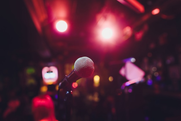 Microphone on stage against a background of auditorium.