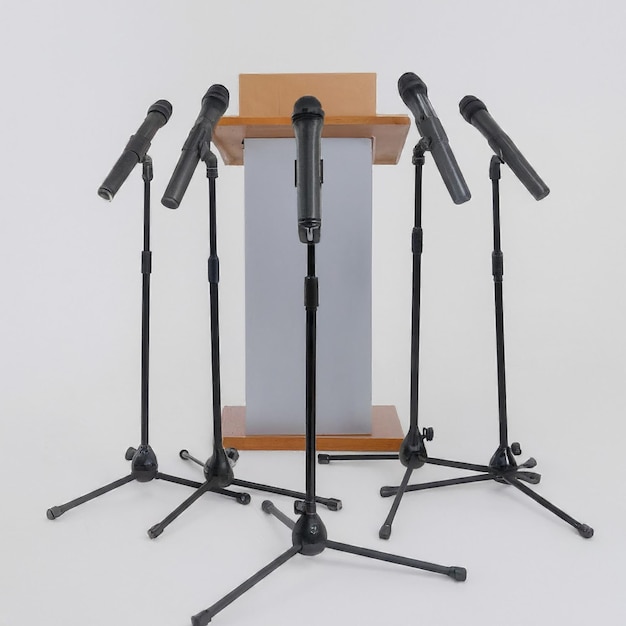 Photo a microphone stand with microphones on it and a sign that says quot the word quot on it