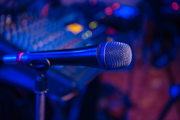 Microphone stands in the holder at a concert in the restaurant. 