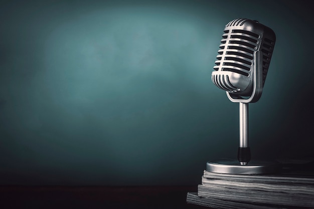 Microphone with magazine on wooden table vintage stlye