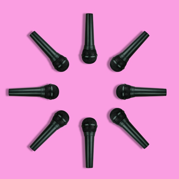 Photo microphones pattern on pink background top view