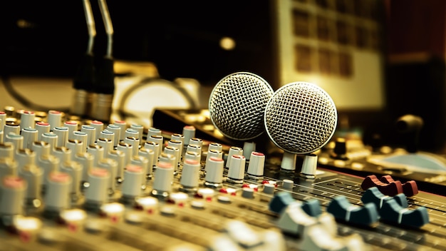 Microphones with sound mixer in studio.