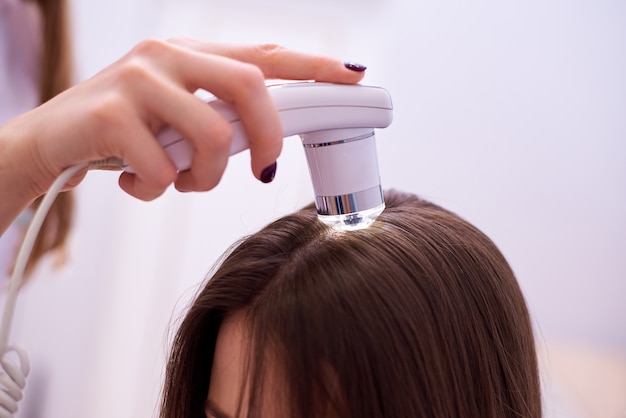 Microscopic examination of the hair and skin of the scalp.