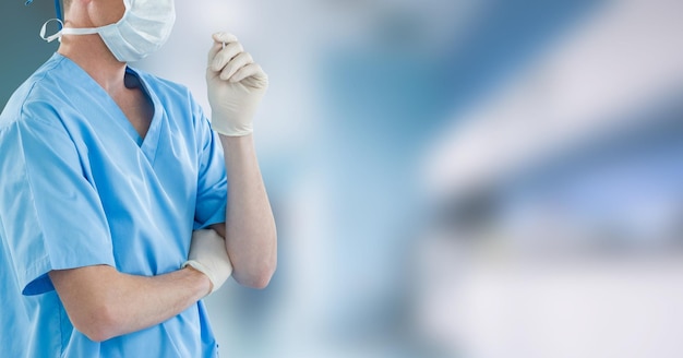 Mid section of female doctor in hospital wearing coronavirus covid19 mask